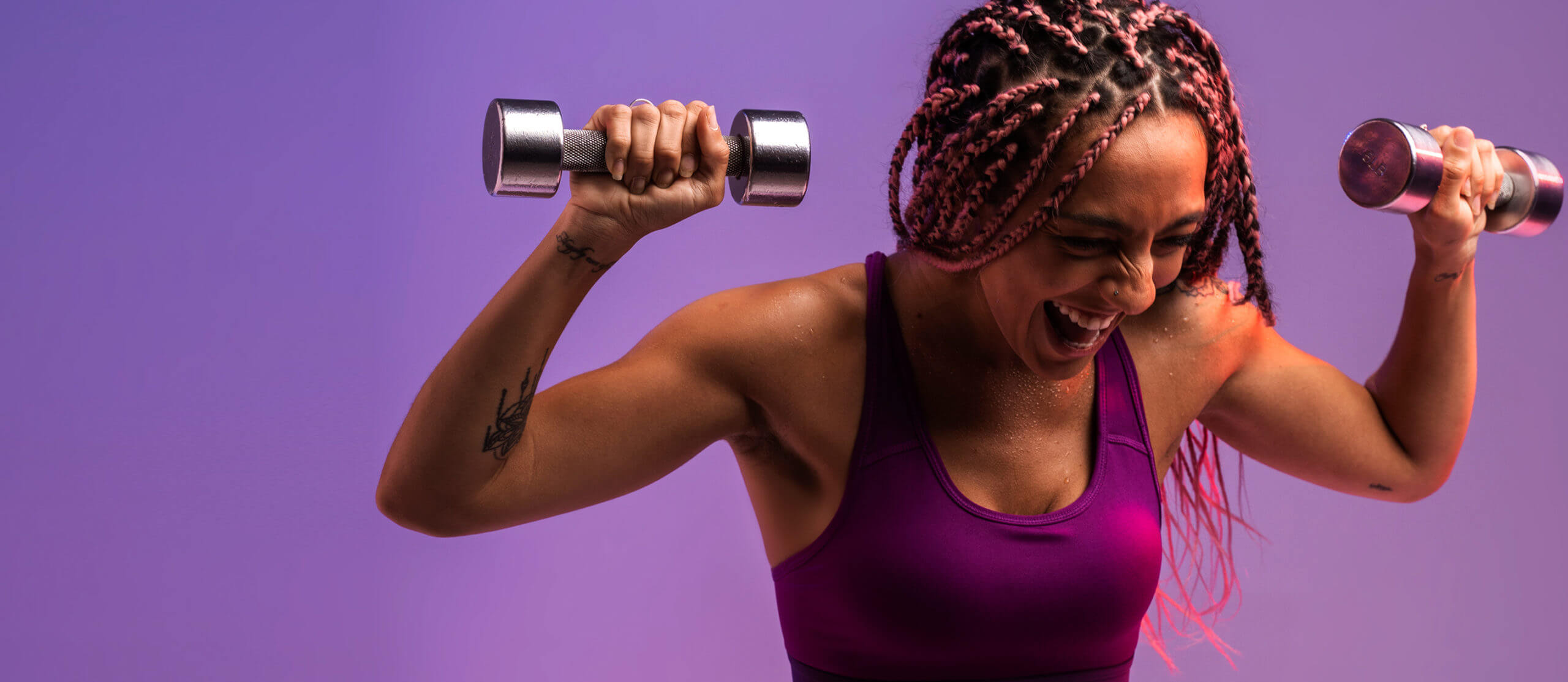 image of woman lifting weights
