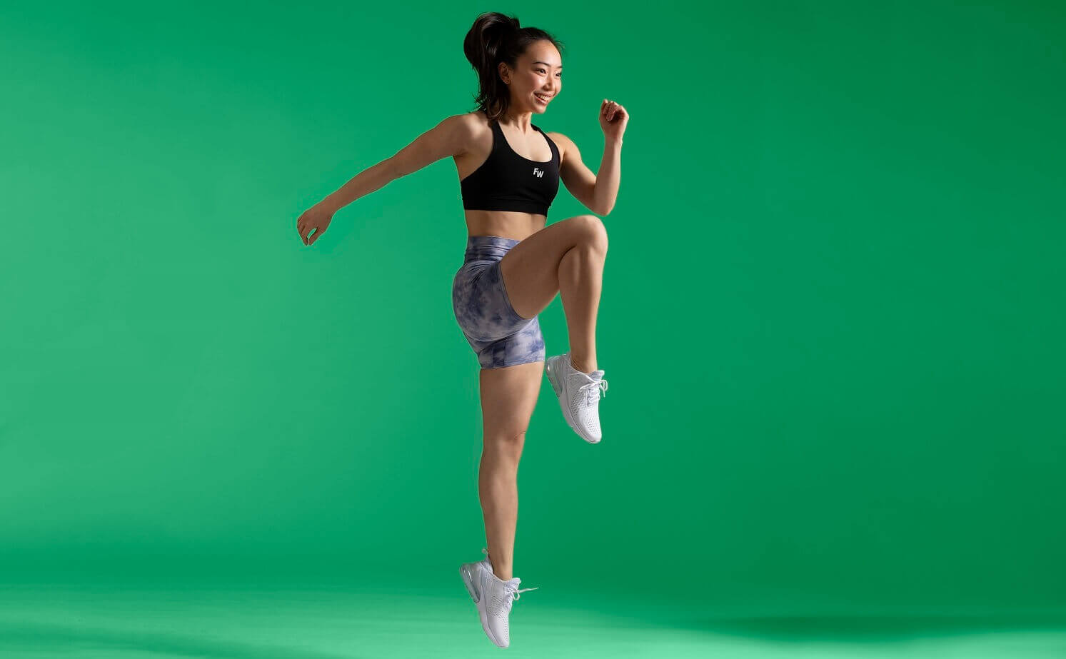 image of woman doing high knees