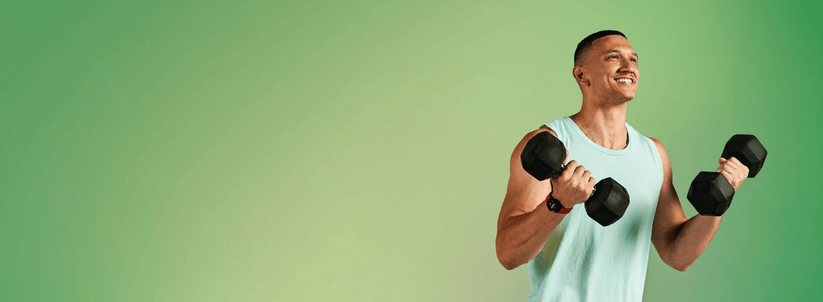 man lifting dumbbells